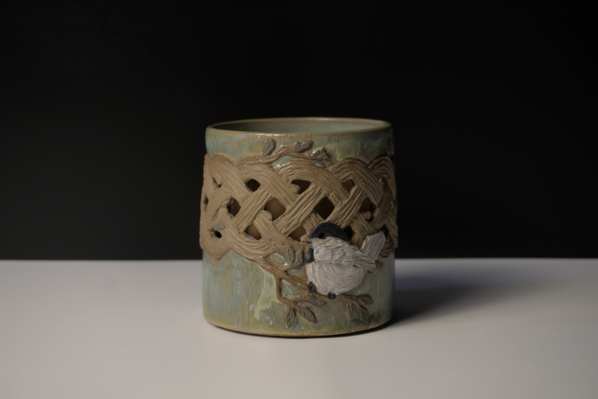 Candle holder with intricate carving